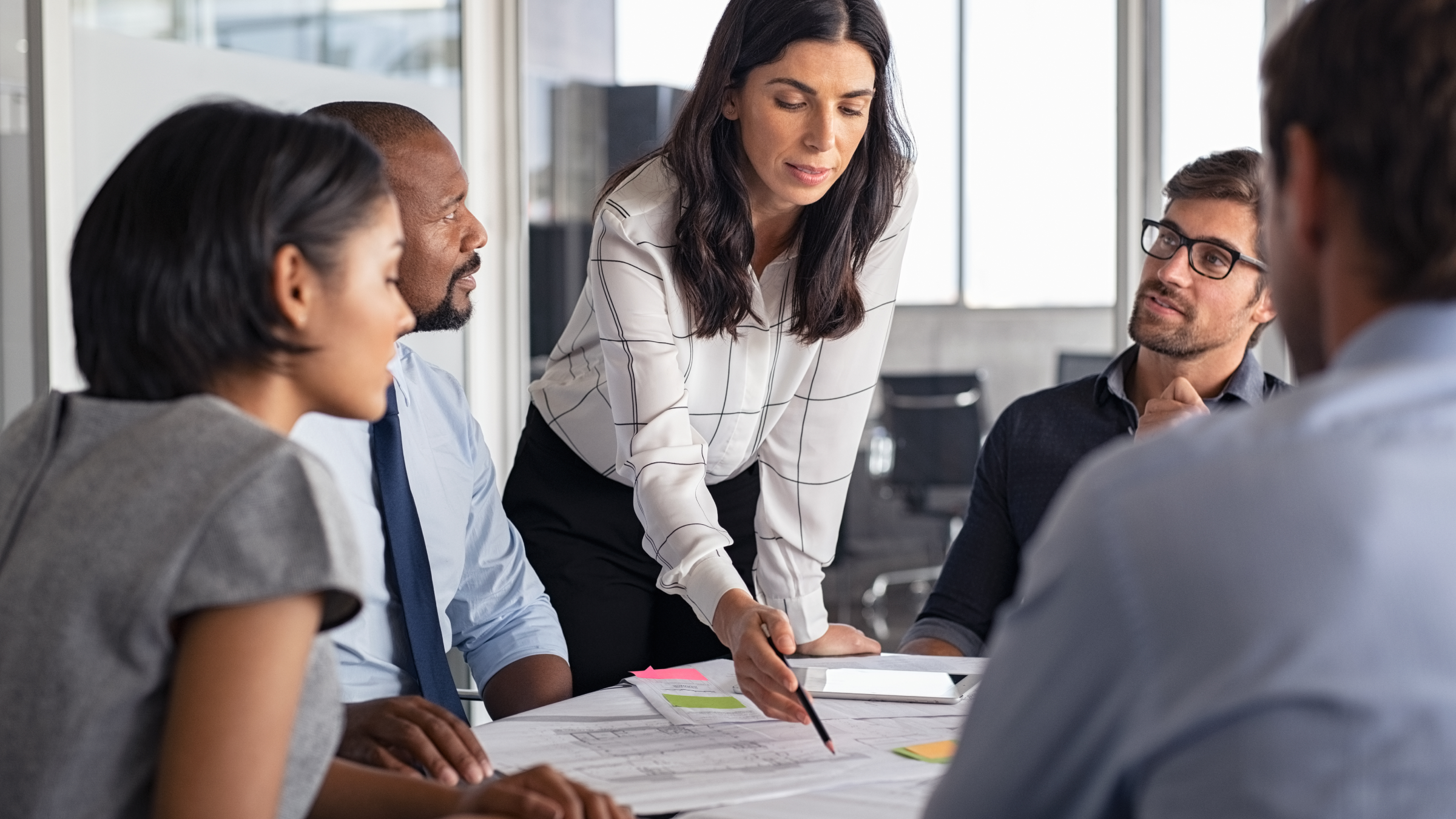 Employees talking during a business meeting.